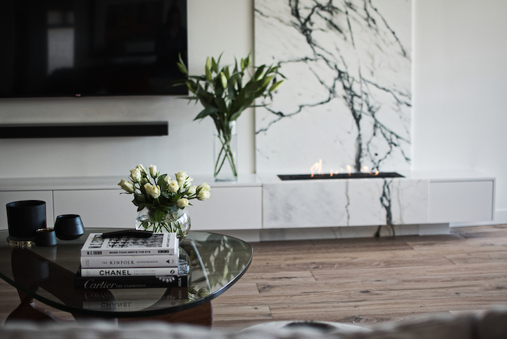 View of fireplace with backing marble.